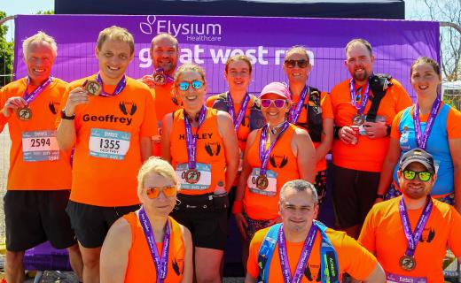A group photo of the Cranbrook Running Club after the 2023 Exeter Great West Run