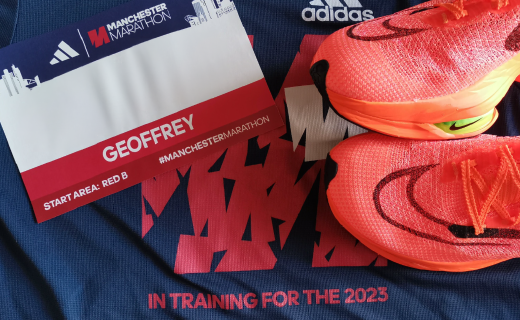 My Manchester Marathon race number (with the actual number hidden) and racing shoes. 